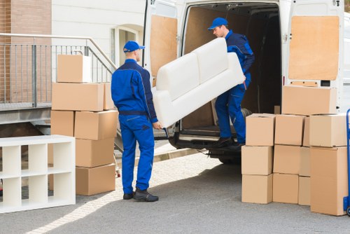 Moving vehicle and removal team working on a commercial relocation in Crystal Palace