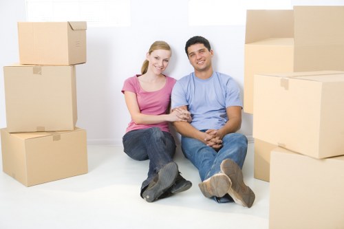 Removal team handling packed boxes during a moving appointment