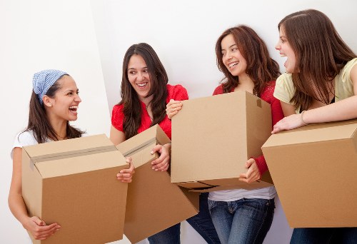 Local moving team organising boxes in a Crystal Palace property