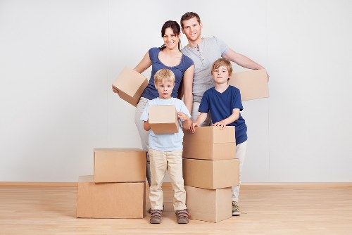 Removal crew handling household furniture and boxes during a Crystal Palace relocation