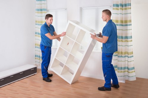 Local team handling heavy furniture pick-up on a Crystal Palace street