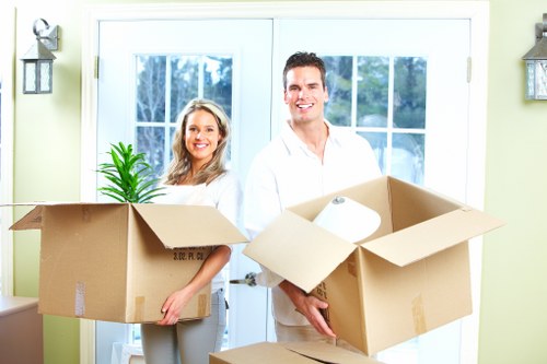 Moving team handling boxes and furniture at a residential property in Crystal Palace