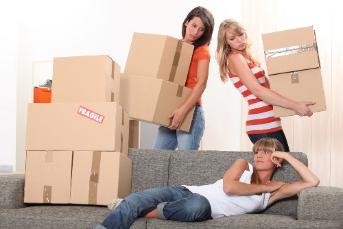 Removalists loading furniture carefully for a local move